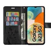 A black flip-style phone case for a Samsung Galaxy A23 5G, shown open with cards and cash inserted, and the phone screen displaying the phone's wallpaper and model name. Produktbild-Vorschau