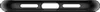 A close-up, top-down view of the bottom edge of a black smartphone case, showing cutouts for ports and speakers. Voir les images du produit