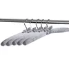 Several padded clothes hangers with bows are hanging on a metal rod. Produktbild-Vorschau