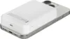 A white Belkin BoostCharge Pro magnetic power bank is attached to the back of a silver iPhone. Voir les images du produit