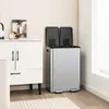A modern kitchen or living space with a white cabinet and a stainless steel dual-compartment trash can. Produktbild-Vorschau