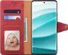 A red leather flip case for a smartphone, open to reveal card slots, a photo of a baby, and a smartphone with a colorful wallpaper. Náhled obrázku produktu