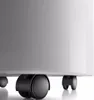 A close-up shot of the bottom of a white appliance, showing its black wheels. Voir les images du produit
