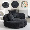 A collage featuring a black beanbag chair with multiple pillows, a close-up of the fabric texture, and a pile of colorful makeup sponges. Podgląd zdjęcia produktu