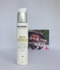 A bottle of Goldwell Dualsenses Rich Repair 6 Effects Serum is placed in front of a photograph of a man with a beard and hat. Náhled obrázku produktu