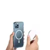 Hands holding an iPhone 13 Pro with a transparent MagSafe case and a separate MagSafe charger. Produktbild-Vorschau