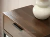 Close-up of a wooden table with a drawer and a white vase. Náhled obrázku produktu