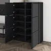 A modern, dark gray and black shoe cabinet with multiple shelves and doors, shown in an interior setting. Produktbild-Vorschau