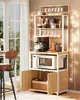 A coffee station setup with a baker's rack, coffee maker, microwave, and storage cabinets, decorated with string lights. Náhled obrázku produktu