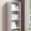 A white bookshelf with various items on its shelves, placed near a window with curtains. Podgląd zdjęcia produktu