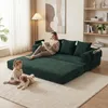 A woman reads a book on a green sofa while a child and a dog play on the floor in front of it. Produktbild-Vorschau