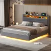 A bedroom scene featuring a modern upholstered bed with integrated LED lighting. Anteprima dell’immagine prodotto