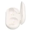 An open white charging case for wireless earbuds, showing the interior compartments and charging pins. Náhled obrázku produktu