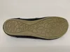 The sole of a black ballerina shoe is shown against a white background. Voir les images du produit