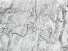A close-up view of marble texture with prominent cracks. Produktbild-Vorschau