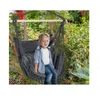 A young child sits in a hanging chair in a garden setting. Produktbild-Vorschau