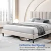A beige upholstered bed with a headboard, shown with a robot vacuum cleaner underneath to demonstrate clearance. Produktbild-Vorschau