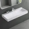 A modern white rectangular wall-mounted sink with a chrome faucet and two soap dispensers, set against a dark gray wall. Produktbild-Vorschau