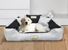 A golden retriever puppy lies in a large dog bed. Voir les images du produit