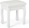 A white upholstered stool with ornate legs against a white background. Produktbild-Vorschau