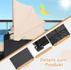 A close-up view of a beige canopy on a black rattan lounge chair, with inset images showing product details like rattan weave, anti-slip feet, and support feet, set against a bright sky. Voir les images du produit