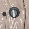 A close-up view of a vacuum seal bag with a button and a valve. Náhled obrázku produktu