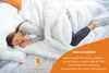 A person sleeping under a white duvet. Produktbild-Vorschau