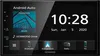 A close-up of a car stereo display showing the Android Auto interface with album art, song title, time, and date. Produktbild-Vorschau
