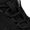 A close-up view of the lacing system of a black shoe. Produktbild-Vorschau