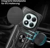 A close-up view of a black phone case with a camera lens cover, a ring holder, and a magnetic plate for car mounting, set against a dark, blurred background suggesting a car interior. Produktbild-Vorschau
