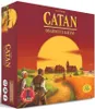 The image shows the box of the board game 'Catan: Settlers of Catan' with a sunset scene and people in the foreground. Náhled obrázku produktu