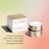 A product shot of a Clarins face cream jar and its outer packaging, set against a gradient background. Anteprima dell’immagine prodotto