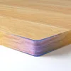 Close-up of the edge of a wooden desk or tabletop. Voir les images du produit