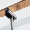 A close-up view of a roller stand supporting a wooden beam. Produktbild-Vorschau