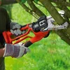 A person is using a Black & Decker electric pruning saw to cut a tree branch. Produktbild-Vorschau