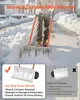 A person is using a snow shovel on a driveway covered in snow. Podgląd zdjęcia produktu