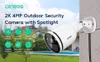 A security camera mounted on a wall, with a backyard scene in the background. Produktbild-Vorschau