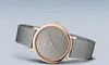 A close-up studio shot of a Bering watch with a rose gold case and a gray dial, set against a light gray background. Náhled obrázku produktu