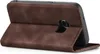 A brown flip cover case for a smartphone is shown from the back, with the cover open and propped up. Produktbild-Vorschau