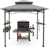 A grill pavilion with a grill and accessories set up. Produktbild-Vorschau