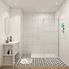 A modern bathroom with a walk-in shower, vanity, and patterned floor. Produktbild-Vorschau