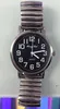 A close-up, top-down view of a silver-colored men's watch with a black dial and a metal expansion band. Produktbild-Vorschau