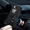 A hand holding a black phone case with a ring holder, magnetically attached to a car air vent mount. Produktbild-Vorschau