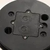 Close-up view of the underside of a black solar sphere, showing a central compartment with two buttons and text. Produktbild-Vorschau