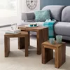 A living room scene with a sofa, coffee table set, and decorative items. Voir les images du produit