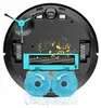 The underside of a robot vacuum cleaner with its brushes and mop pads visible, demonstrating its cleaning function. Náhled obrázku produktu