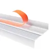 A close-up view of a white stair nosing profile with an orange protective film being peeled back. Anteprima dell’immagine prodotto