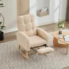 A beige rocking chair with an extended footrest is shown in a living room setting. Voir les images du produit