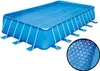 A rectangular swimming pool with a blue solar cover. Anteprima dell’immagine prodotto