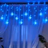 Blue snowflake string lights are hung over sheer white curtains, creating a festive winter atmosphere. Anteprima dell’immagine prodotto